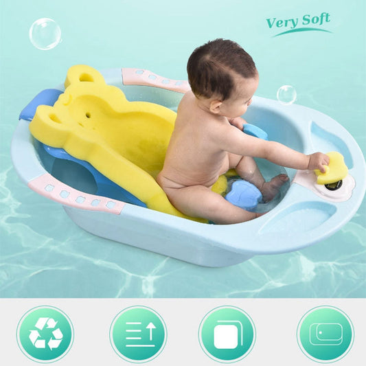  baby in bath tub with yellow  bath mat
